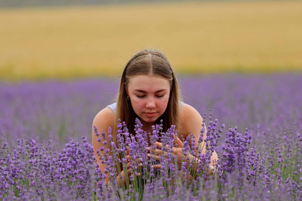 Girl in lavender field, peaceful moment.